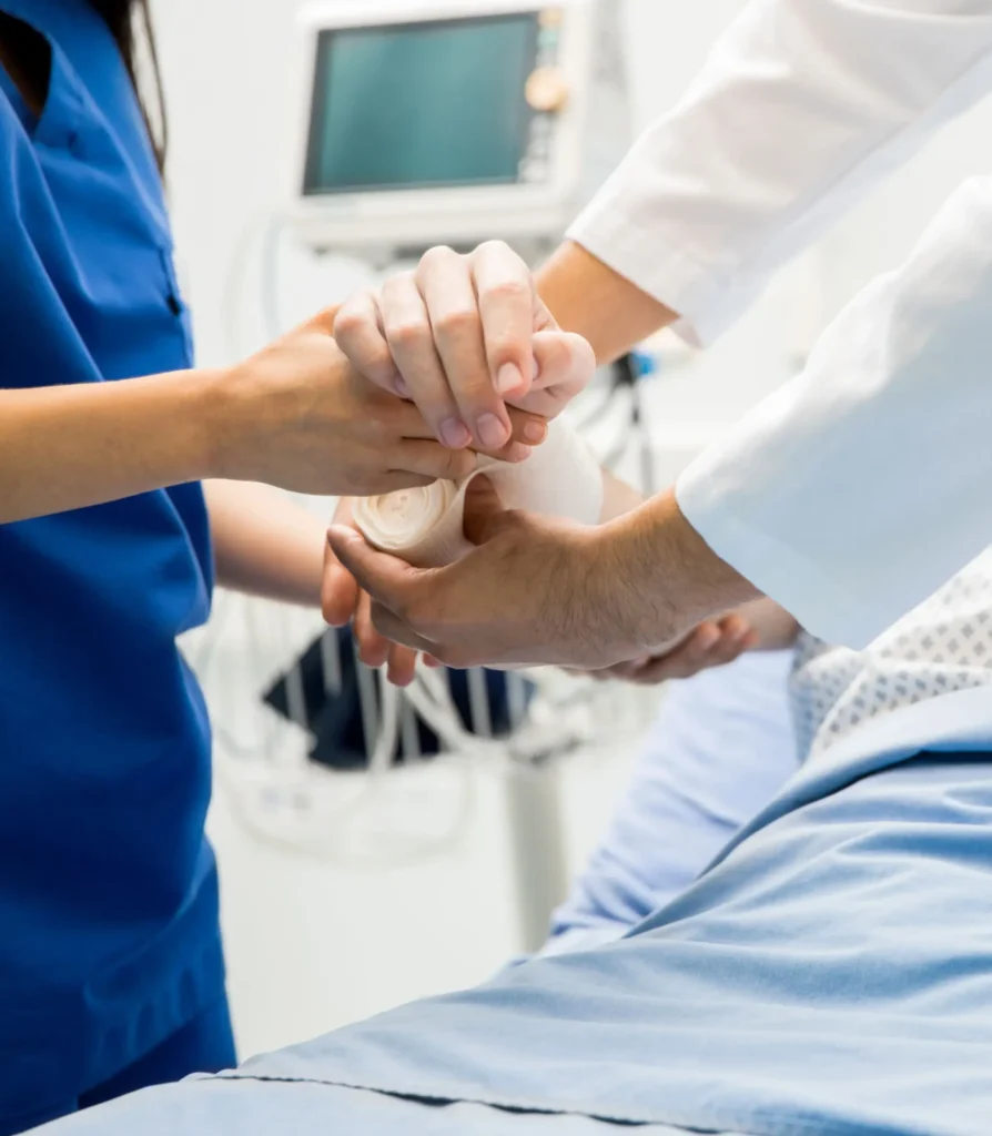 Putting bandage on a patient