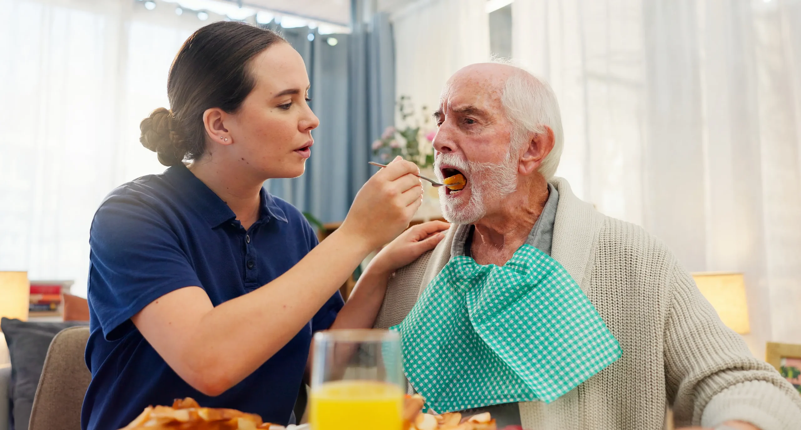 Feeding, nurse or senior man