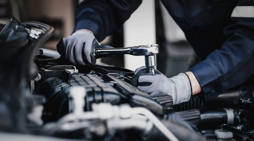 Professional mechanic working on the engine