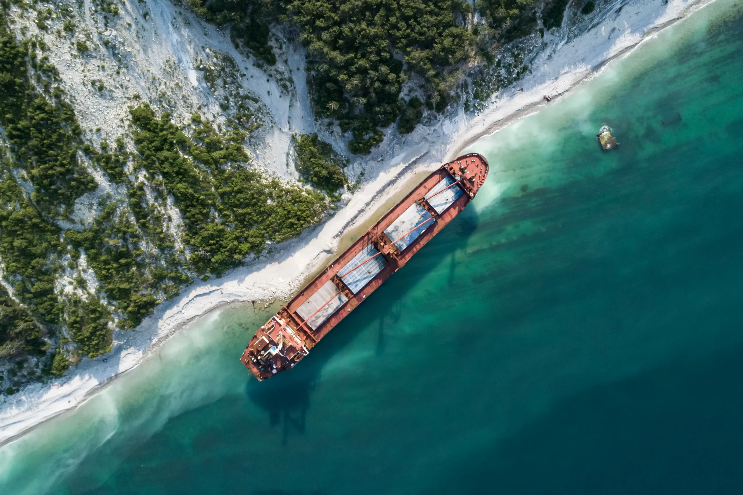 Aerial top down view of an abandoned bulk-carrier dry cargo ship