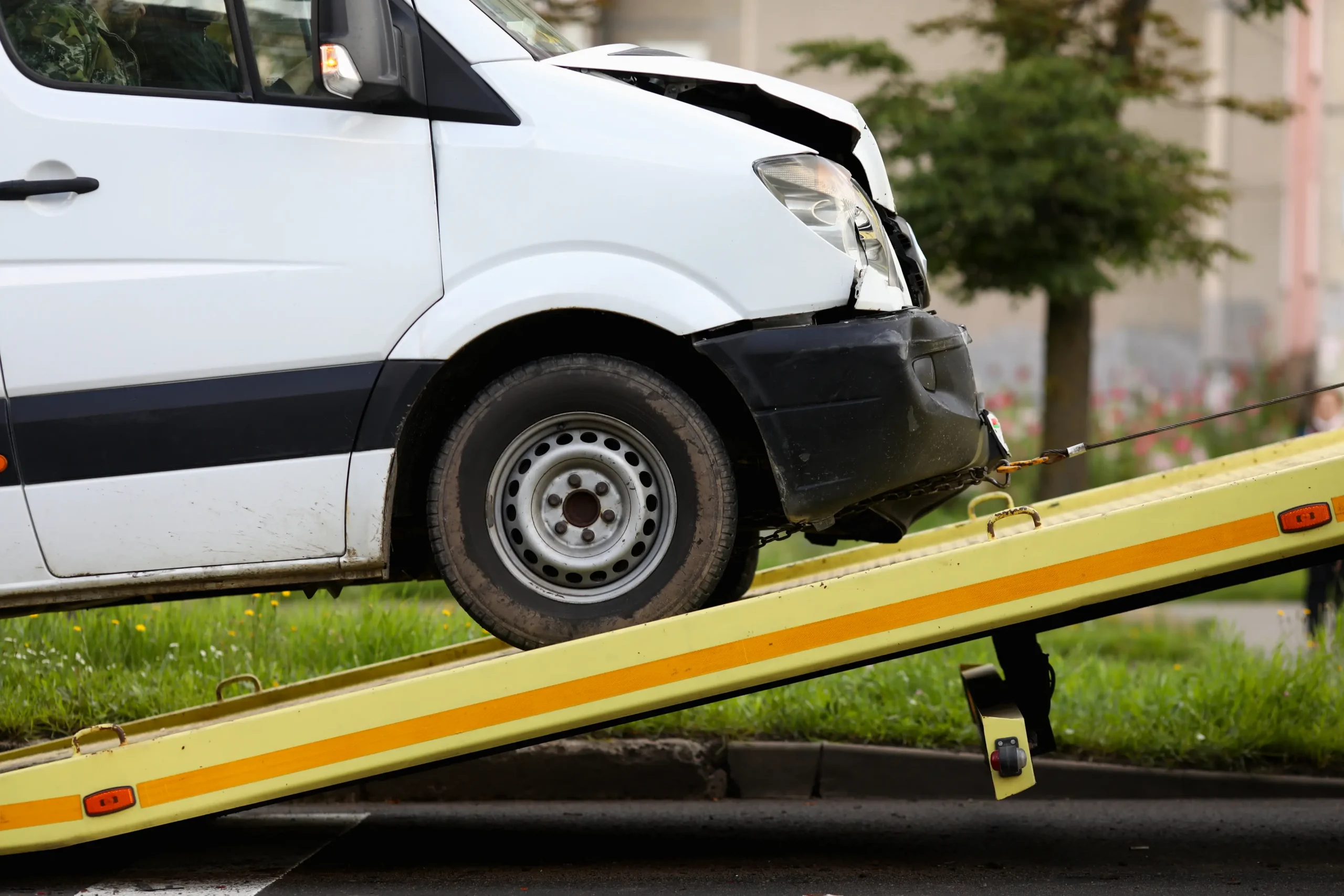 Crashed car is immersed in tow truck