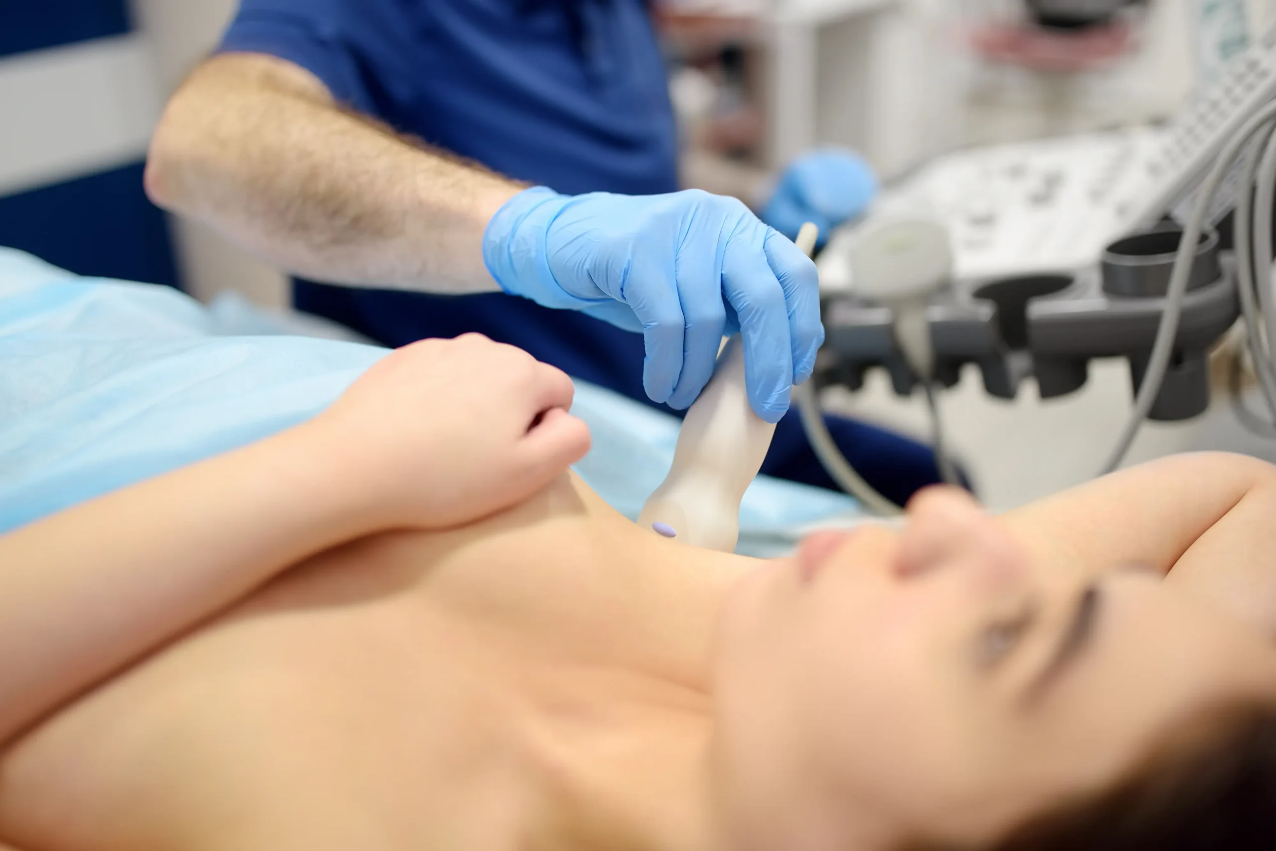 Mammologist doctor examines a woman breasts