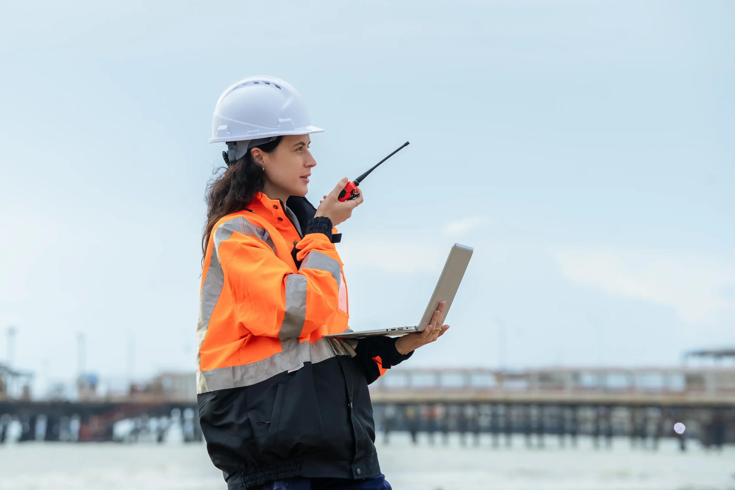 Profile view of a female engineer reporting
