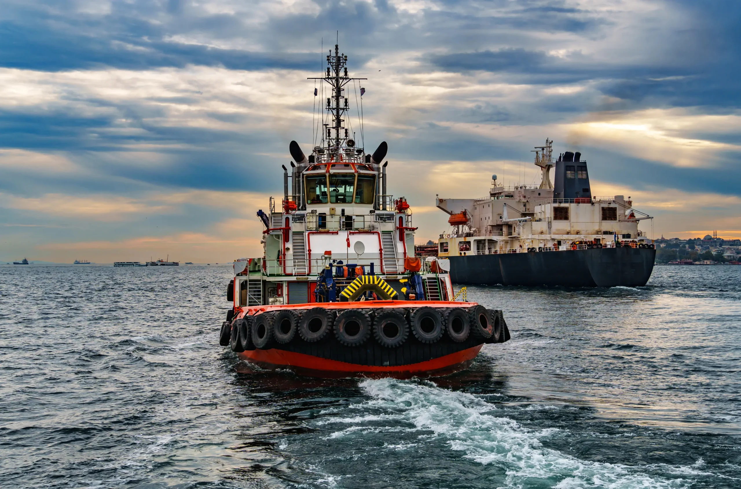 large tanker ship and tug boat