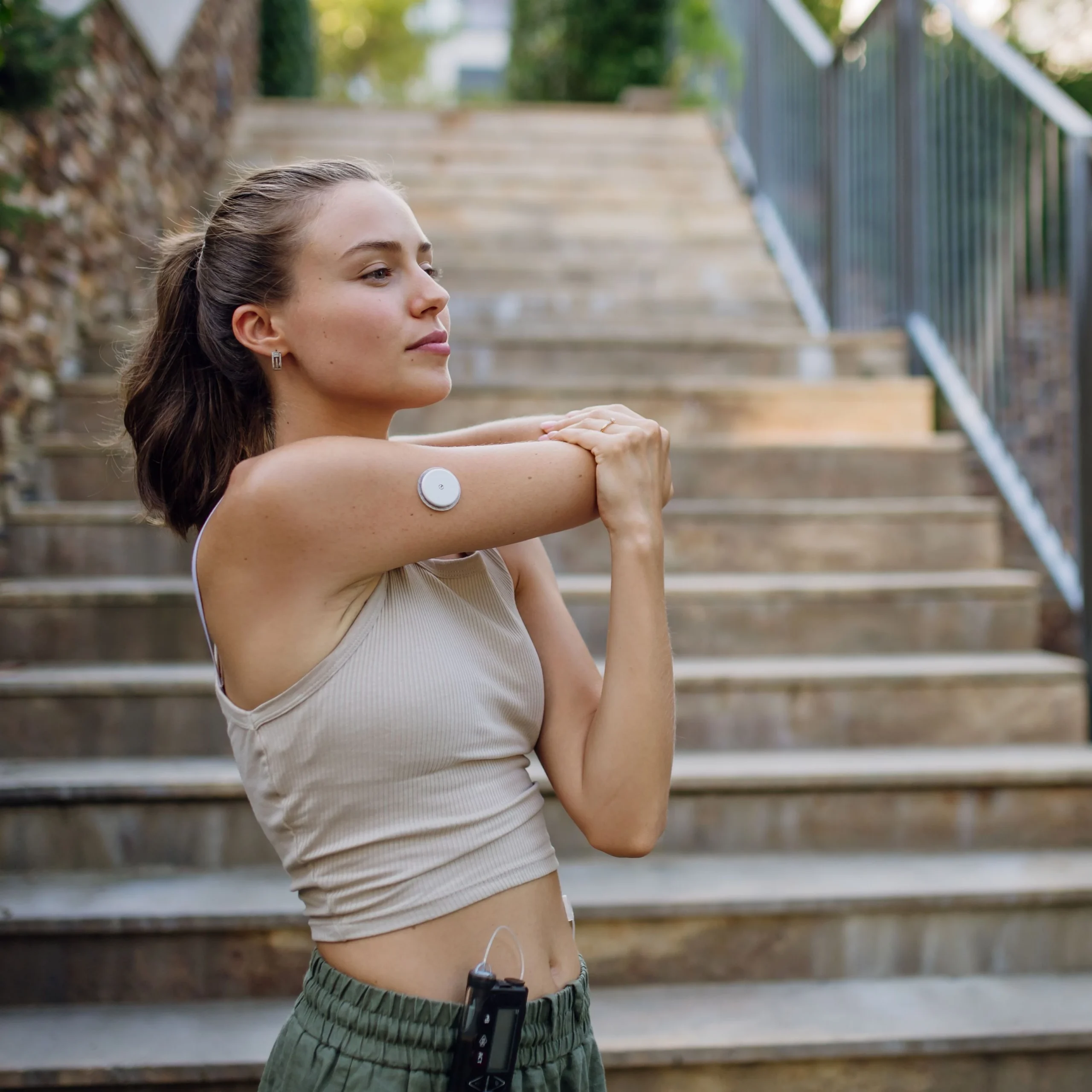 Girl with diabetes monitoring device